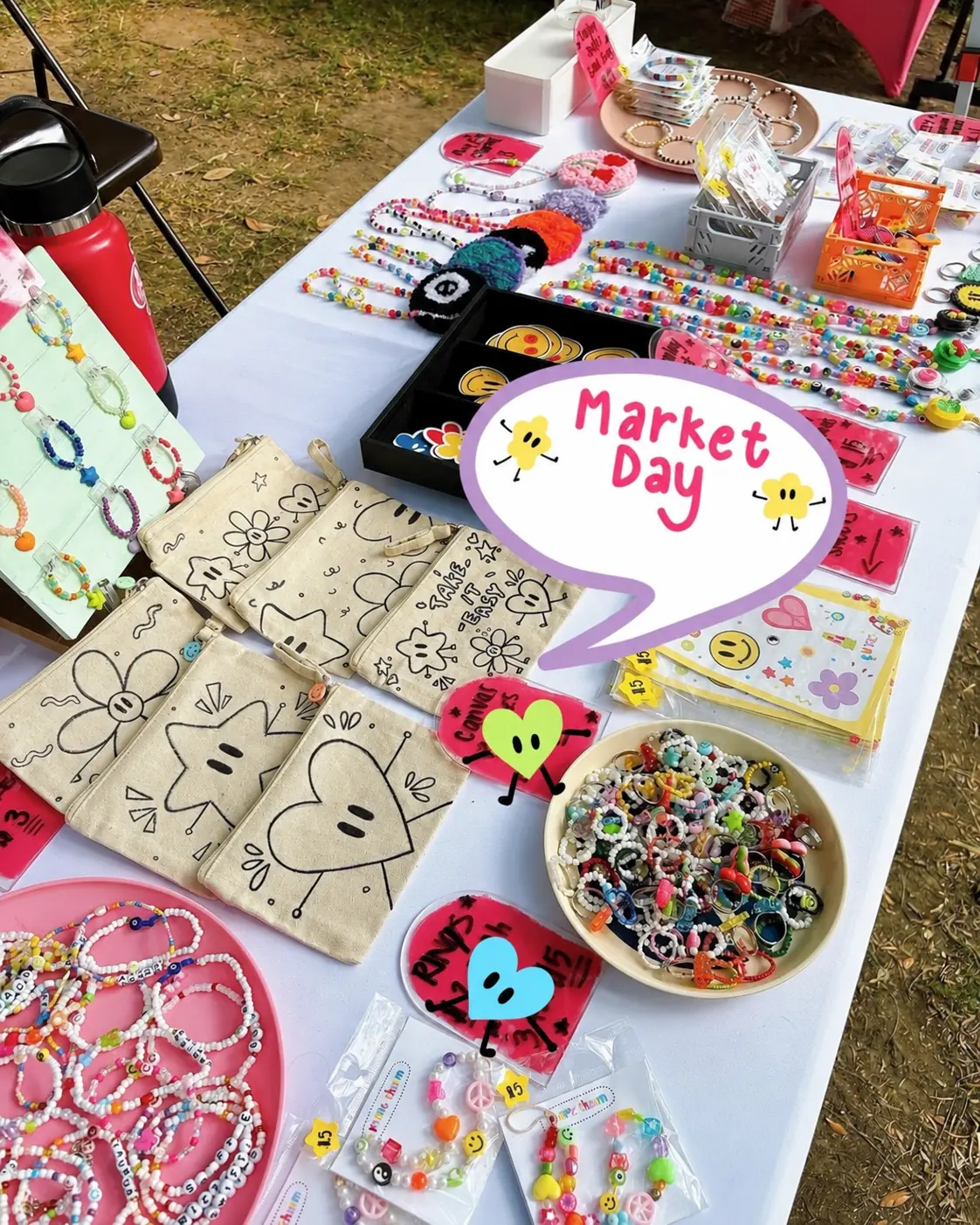 A table with children's jewelry, drawings and crafts